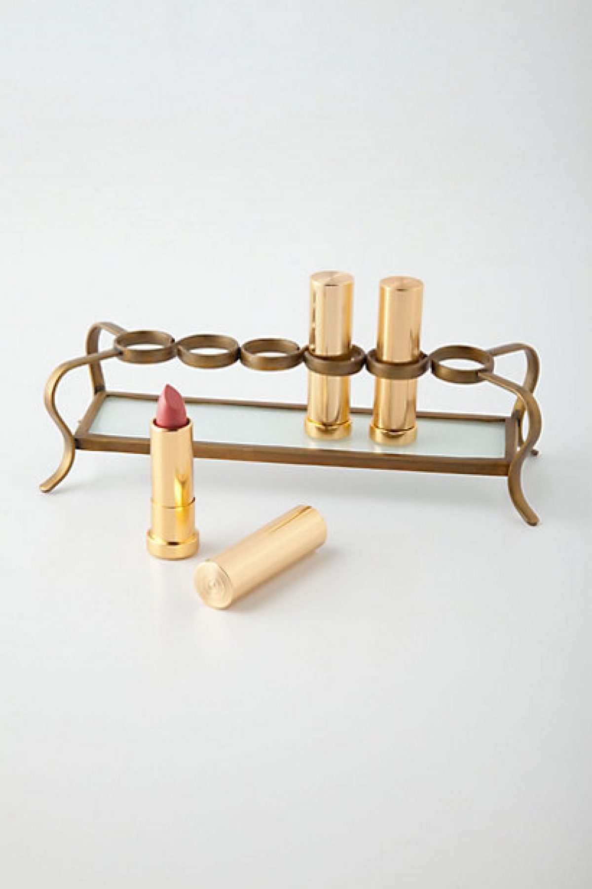 An early 20th century 18ct gold lipstick holder. : Lot 604